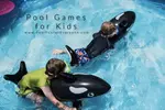 two boys on whale floats pool party games