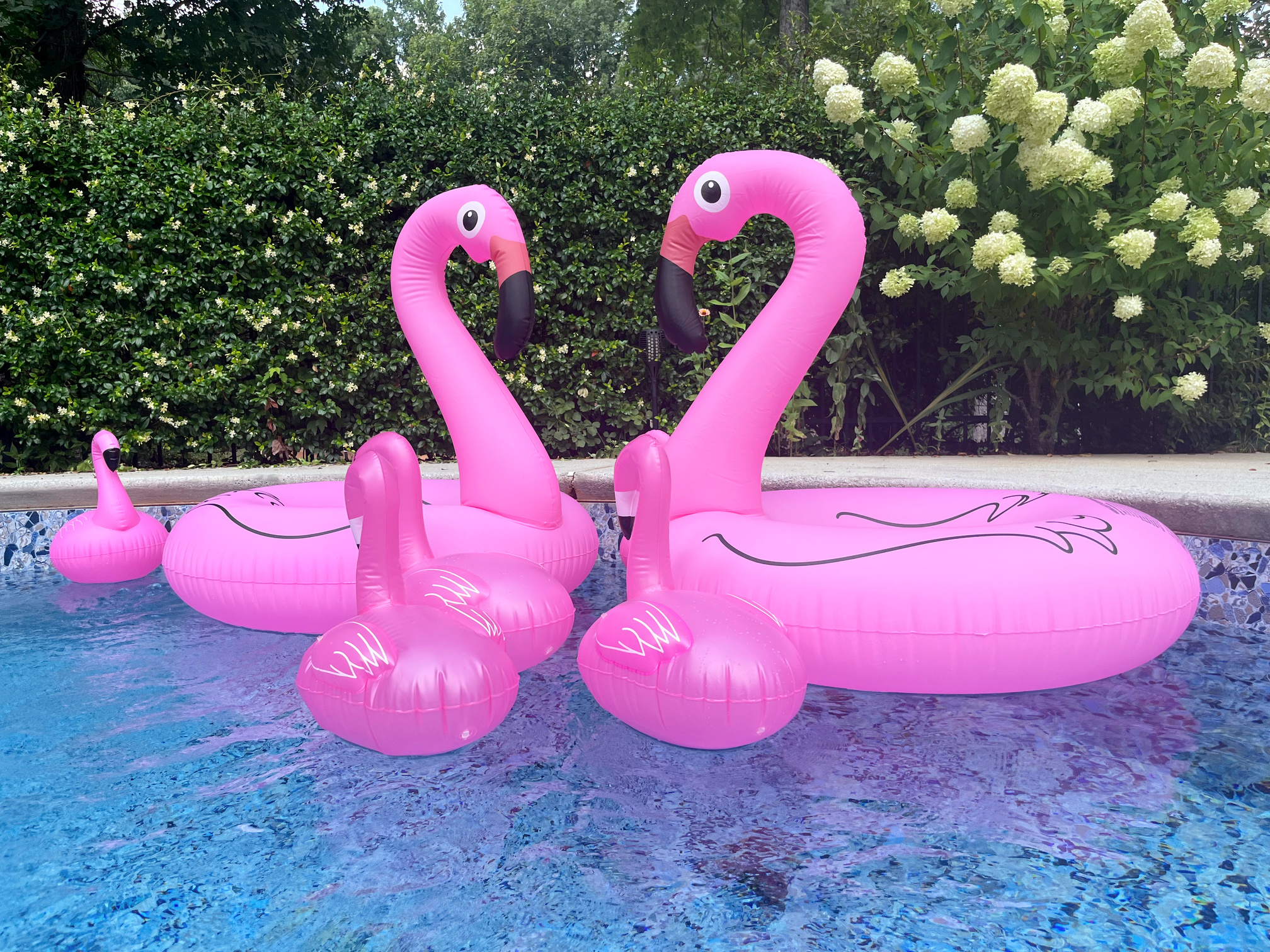 small and large flamingo floats