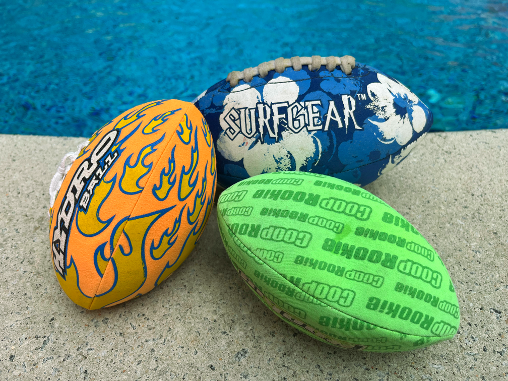 3 waterproof footballs by the pool