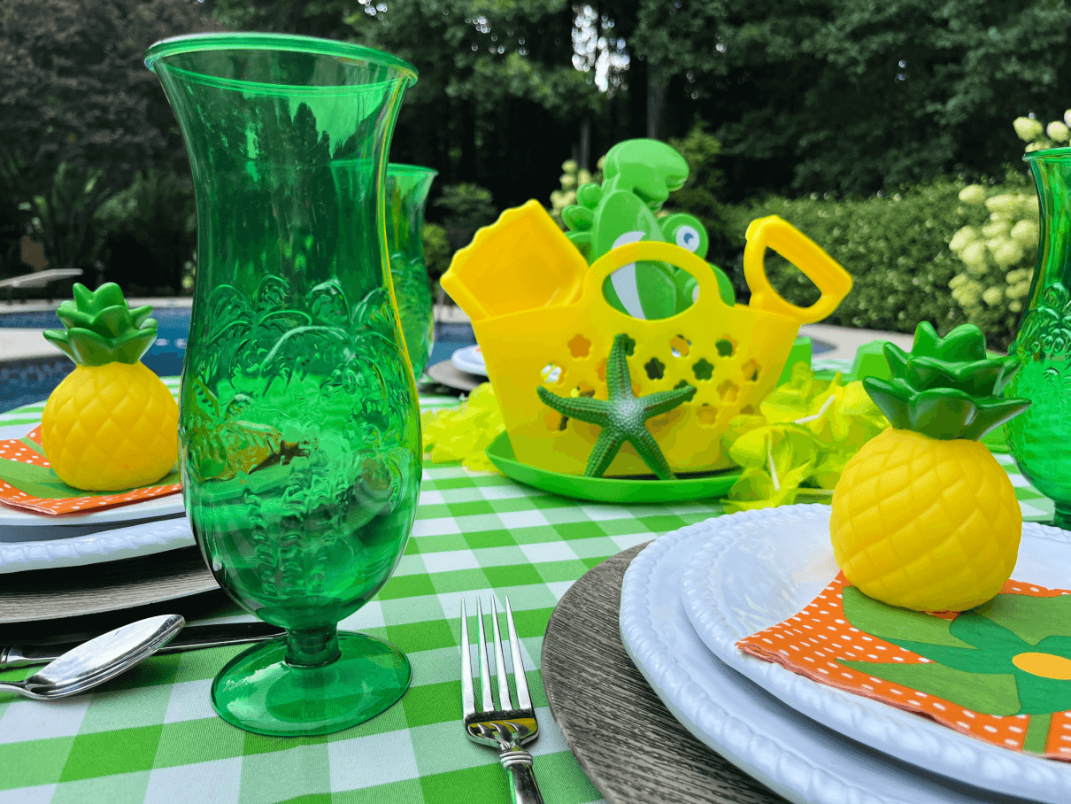 yellow beach bag and sand toys for pool party table centerpiece