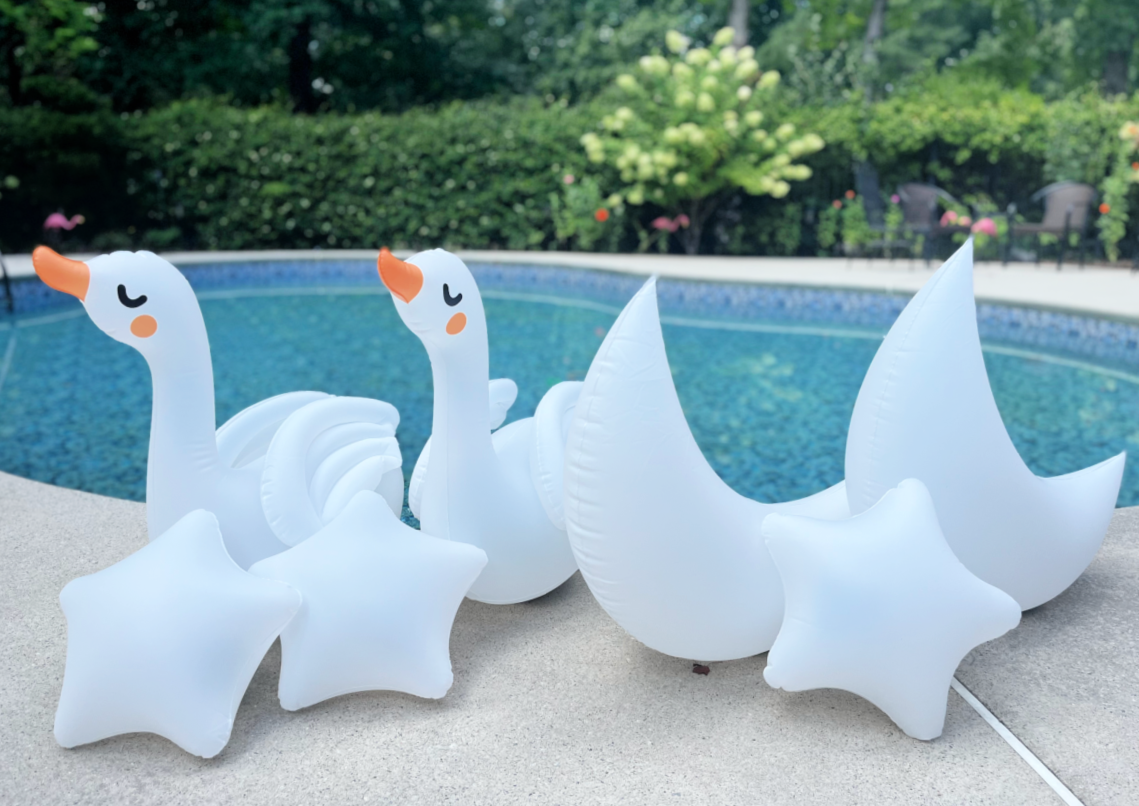 swan, moon, and star shaped floating pool lights