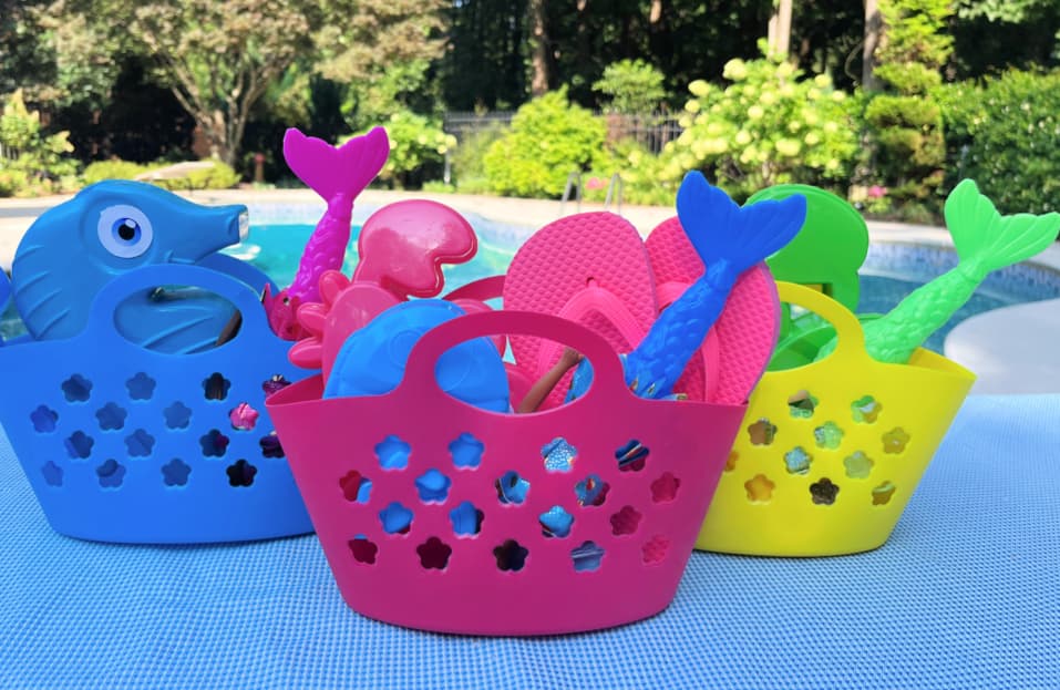 mermaid pool party favors in colorful plastic beach bags