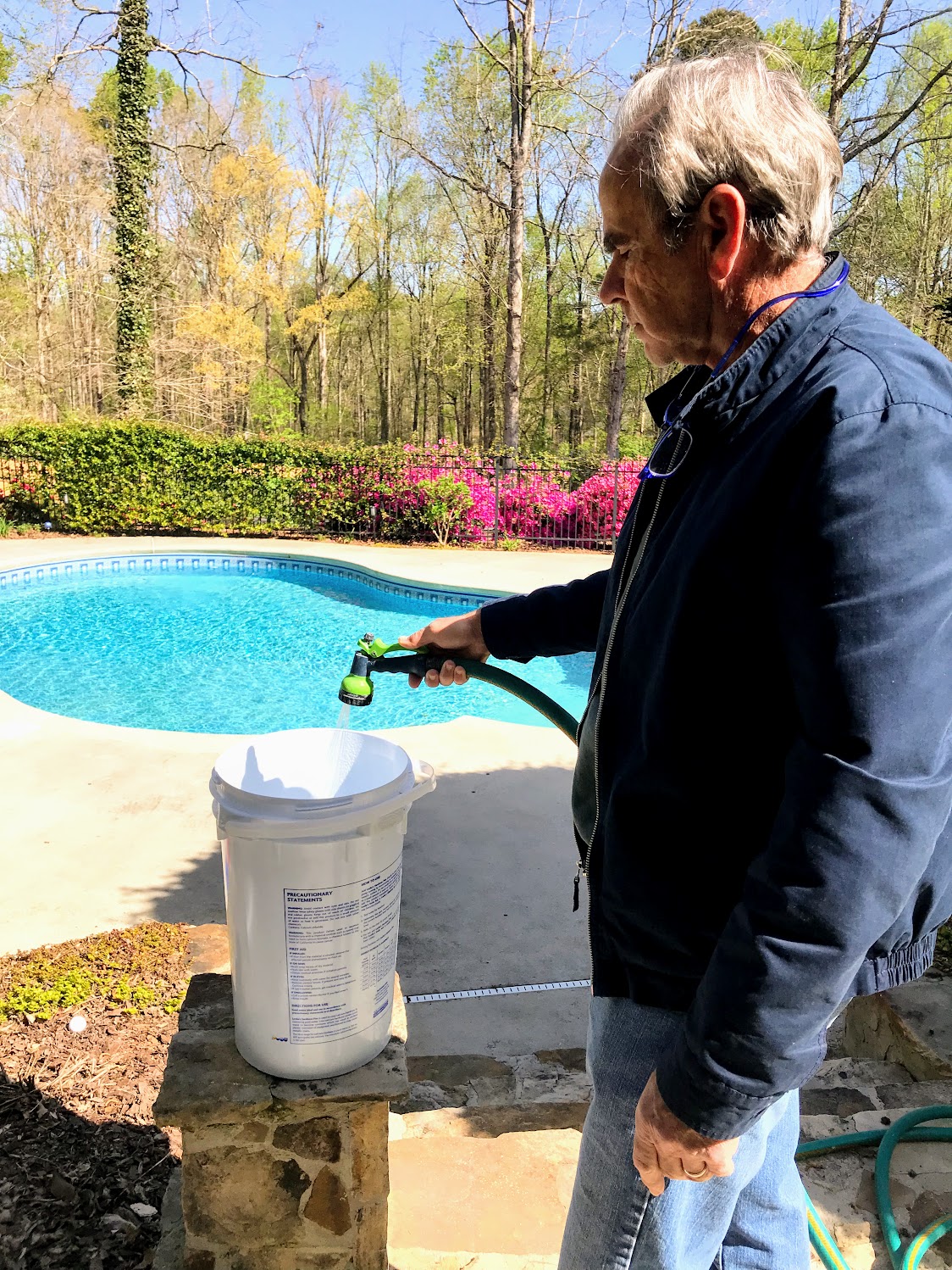 mixing chemicals for swimming pool