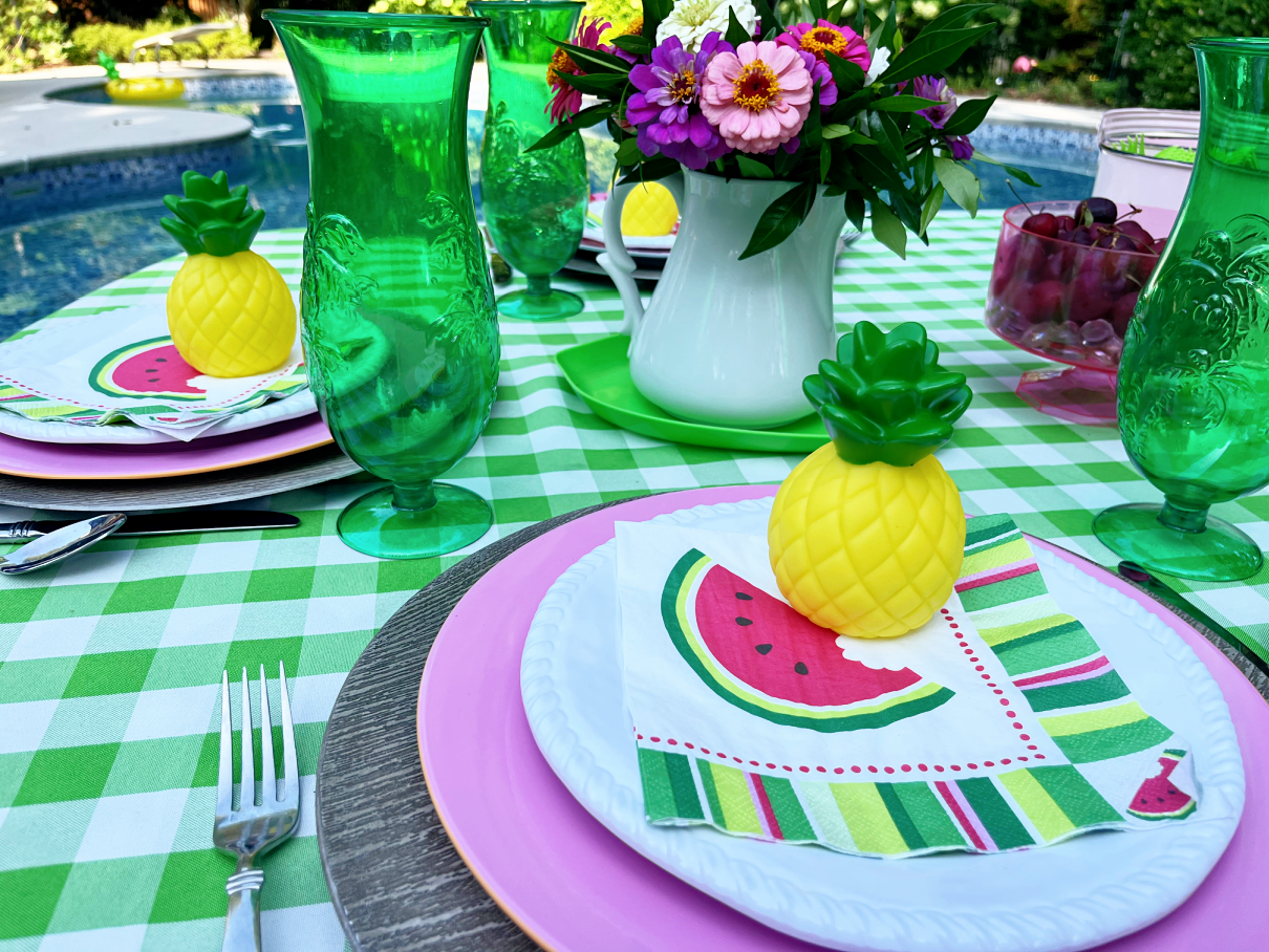 watermelon napkins on pink plates 